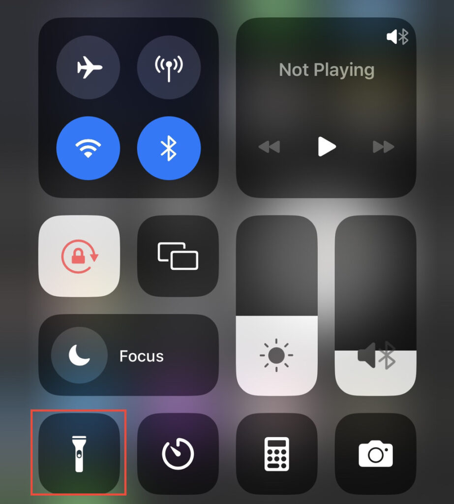 Tap on the "Torch" icon on the control center.