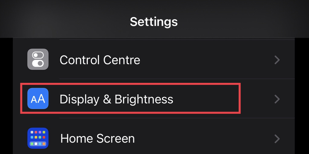 Choose "Display & Brightness" from the settings menu.