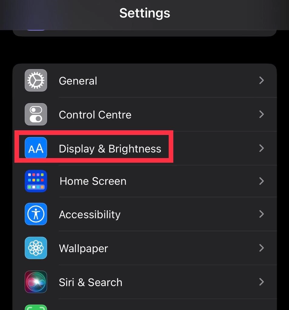 Tap on Display and Brightness.
